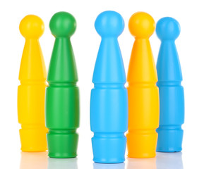 Colorful plastic skittles of toy bowling isolated on white