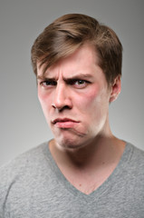 Obraz premium Caucasian Man Scowling Portrtait