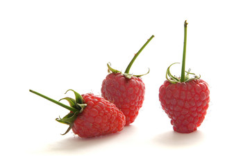 Three raspberries isolated on white