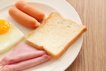 Part of bread with bacon dish breakfast on white background.