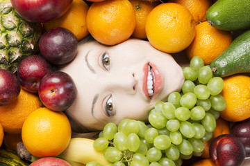 Woman face in fruits