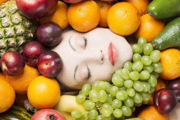 Woman face in fruits