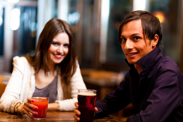 Friends having a drink in a pub