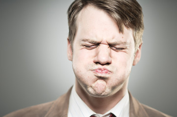 Caucasian Man Blowing Cheeks Expression Portrtait