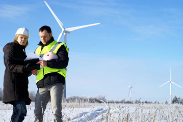 engineers with wind turbines