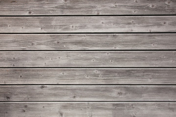 weathered grey boards of fencing