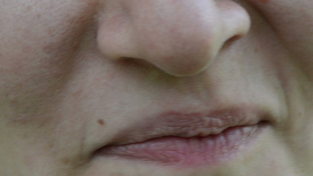 closeup woman face lips mouth eat ecologic blackberry smile