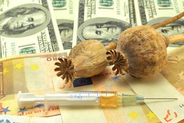 syringe, poppy and notes