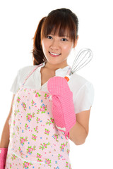 Asian girl holding egg beater