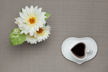 coffee and white artificial flowers