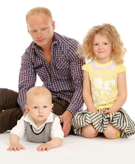 Peaceful family sitting on the floor