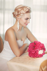 Beautiful bride in wedding dress with bouquet bridal flowers