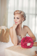 Beautiful bride in wedding dress with bouquet bridal flowers