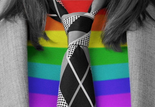 Caucasian business woman with a tie, rainbow flag pattern