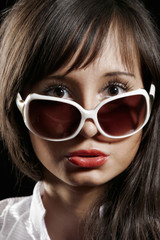 Portrait of a beautiful sexy girl with sunglasses