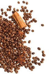 Roasted coffee beans with anise star and cinnamon sticks.