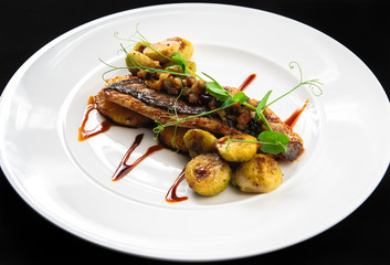 Fried chicken fillet with potatoes and pineapples