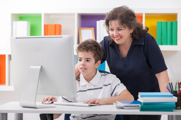 woman using computer with son