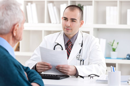 doctor talking with senior  patient