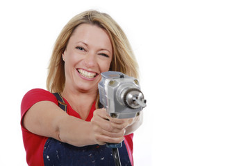 Glückliche Frau mit Bohrmaschine - woman with hand drill