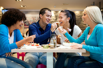 Group of teenagers enjoying in lunch
