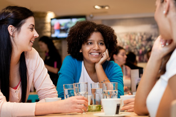 teenagers girls in cafe