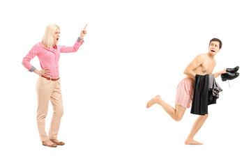 Full length portrait of a woman shouting at a naked guy running