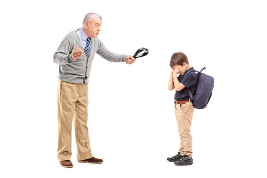 Angry grandfather holding a belt and shouting at his nephew