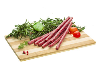 Salami with rosemary, basil and tomato