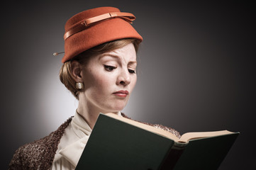 Retro Styled Woman Reading A Book - 51847786