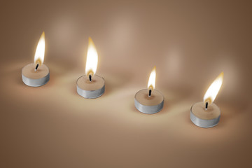 Four candles on brown background