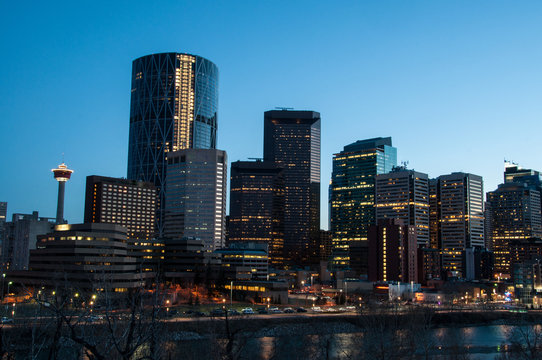 Calgary skyline at dusk, with Bow in foreground.