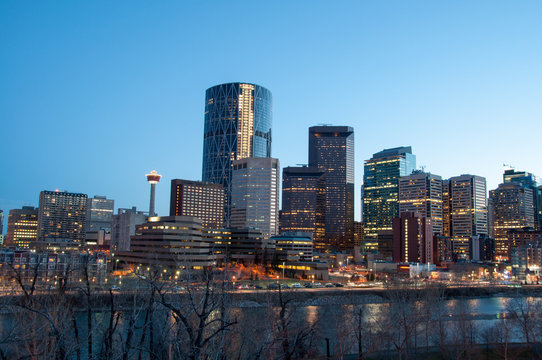 Calgary skyline at dusk, with Bow in foreground.