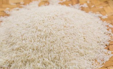 Rice grain in a wicker tray close up