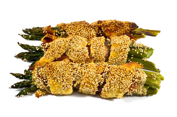 bunch of asparagus rolled with  puff pastry and speck
