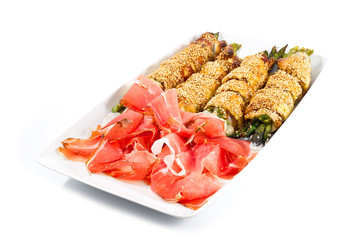 bunch of asparagus rolled with  puff pastry and speck