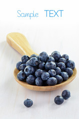 Blueberries in wooden spoon