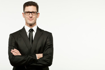 Businessman in black suit on white.