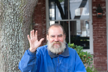 Homeless man waving