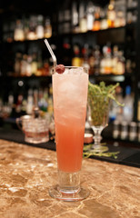 Long drink cocktail on bar counter