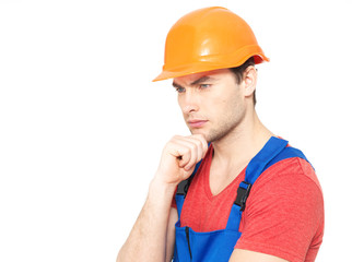 portrait of thinking handyman in uniform