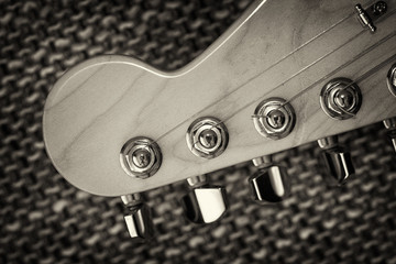 Electrical guitar headstock closeup. Sepia effect with vignette