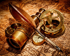 Vintage items on ancient map.
