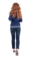 back view of jumping  woman  in  jeans