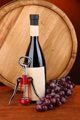 Composition of corkscrew and bottle of wine, grape, wooden
