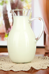 Pitcher of milk on table in room