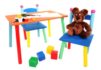 Small and colorful table and chairs for little kids isolated