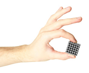 Neocube (toy) on man hand, isolated on white