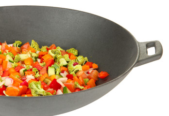 Vegetable ragout in wok, isolated on white