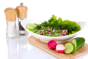 Vitamin vegetable salad in plate isolated on white